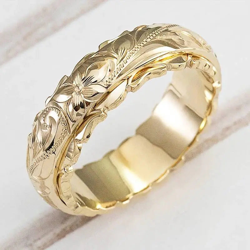 Anillo dorado con flor de estilo antiguo