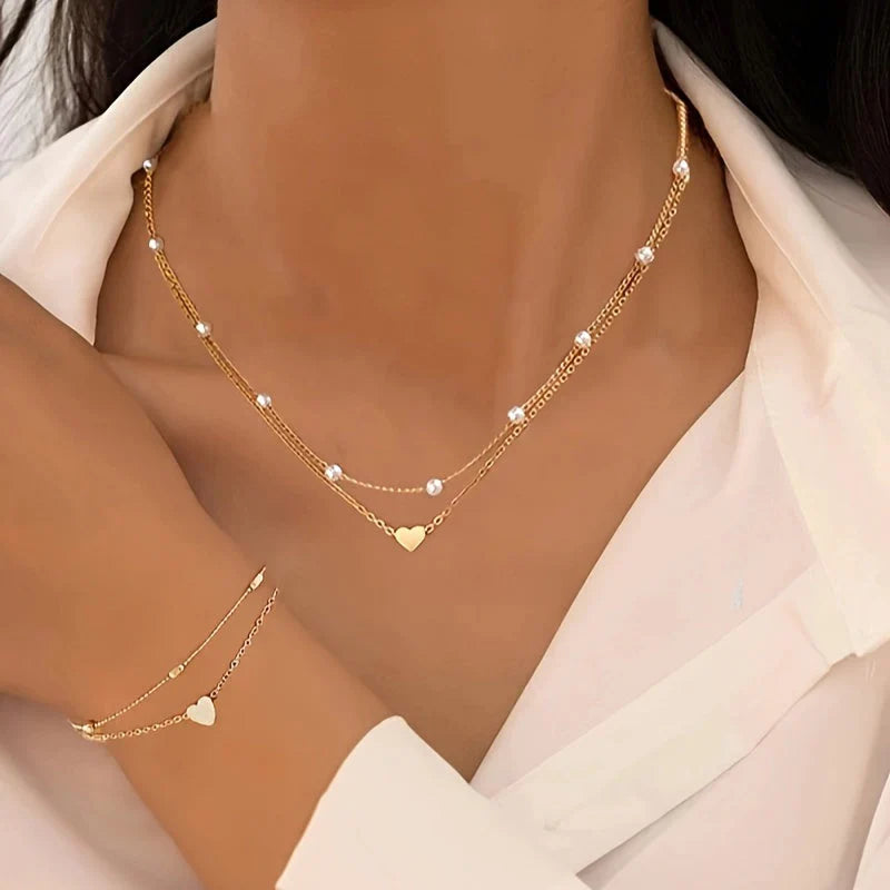 Conjunto de collar y pulsera con corazón
