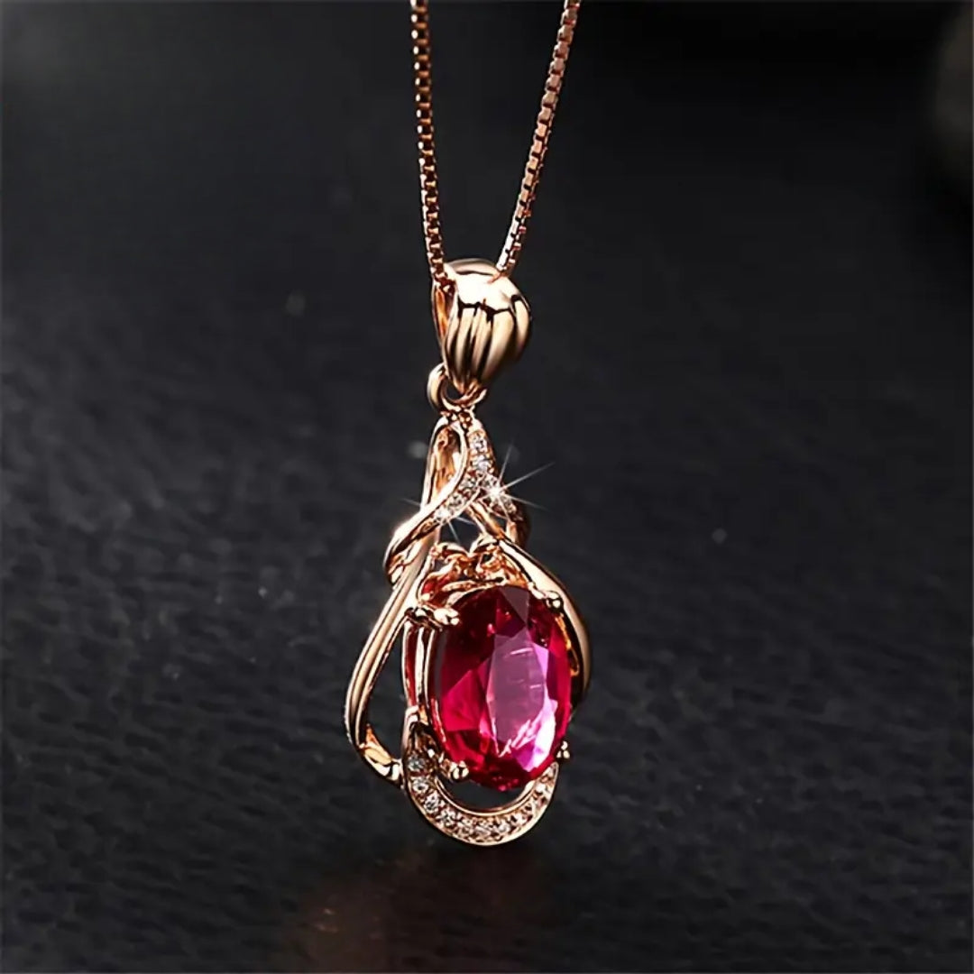 Collar dorado con cristales rojos