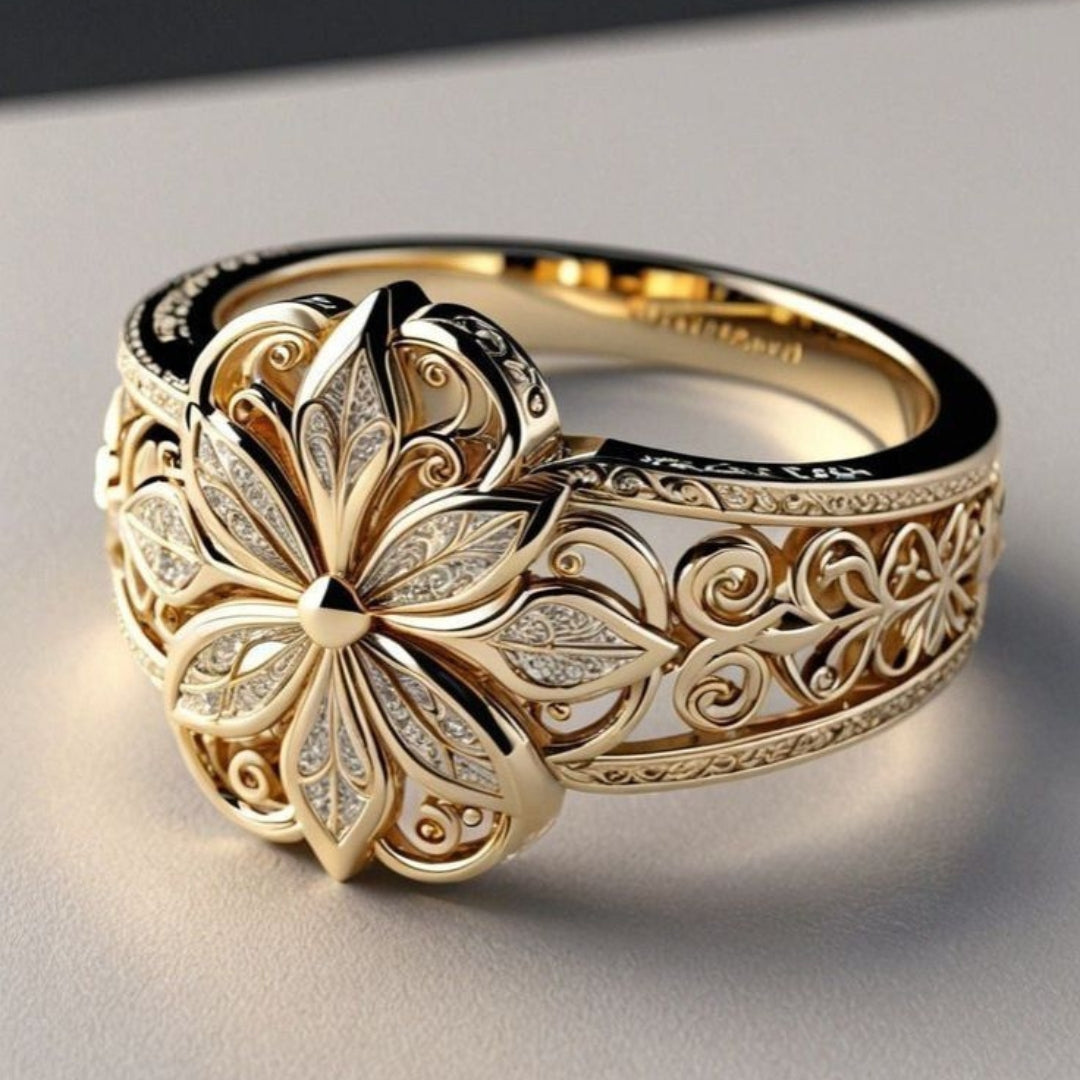 Anillo dorado con circonitas de flor