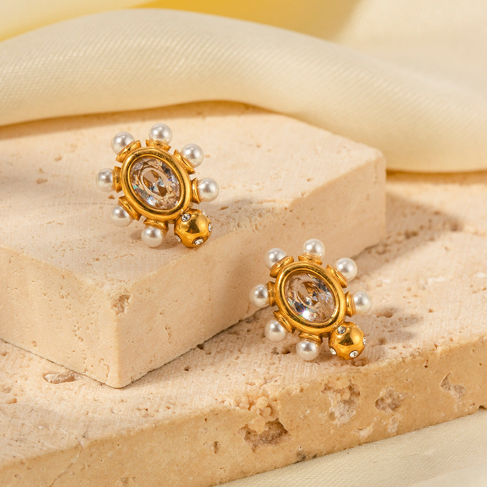 Pendientes dorados con perla