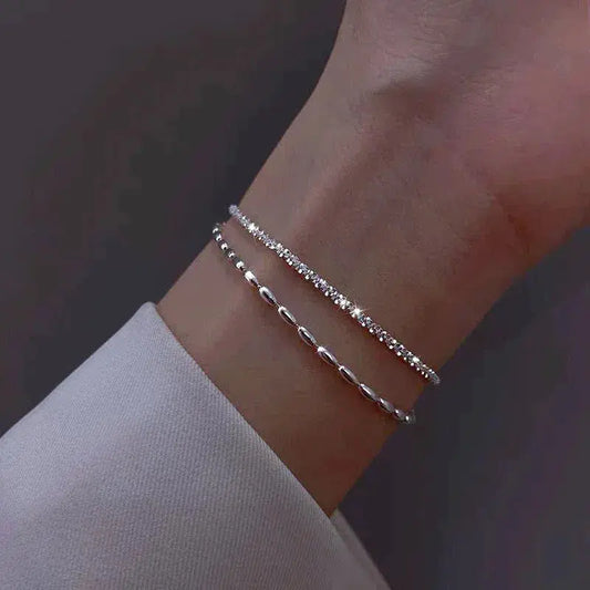 Set de pulseras plateadas con circonitas