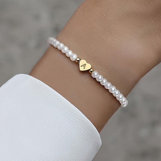 Pulsera de perlas con inicial en corazón