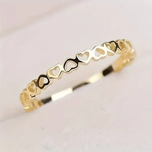 Anillo de corazones dorado