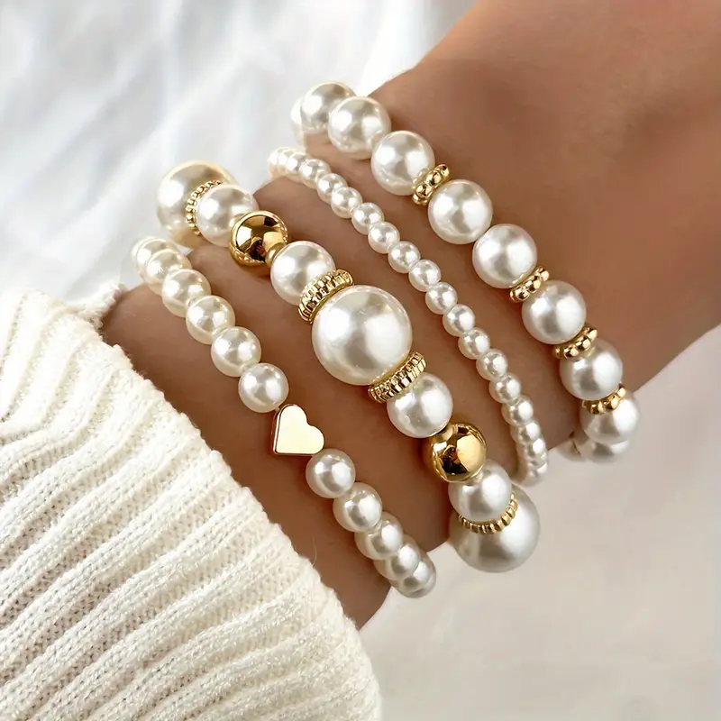 Set de pulseras de perlas con corazón