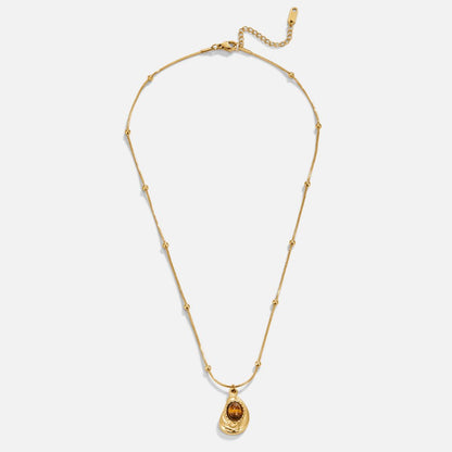 Collar dorado con piedra marrón, vista 5